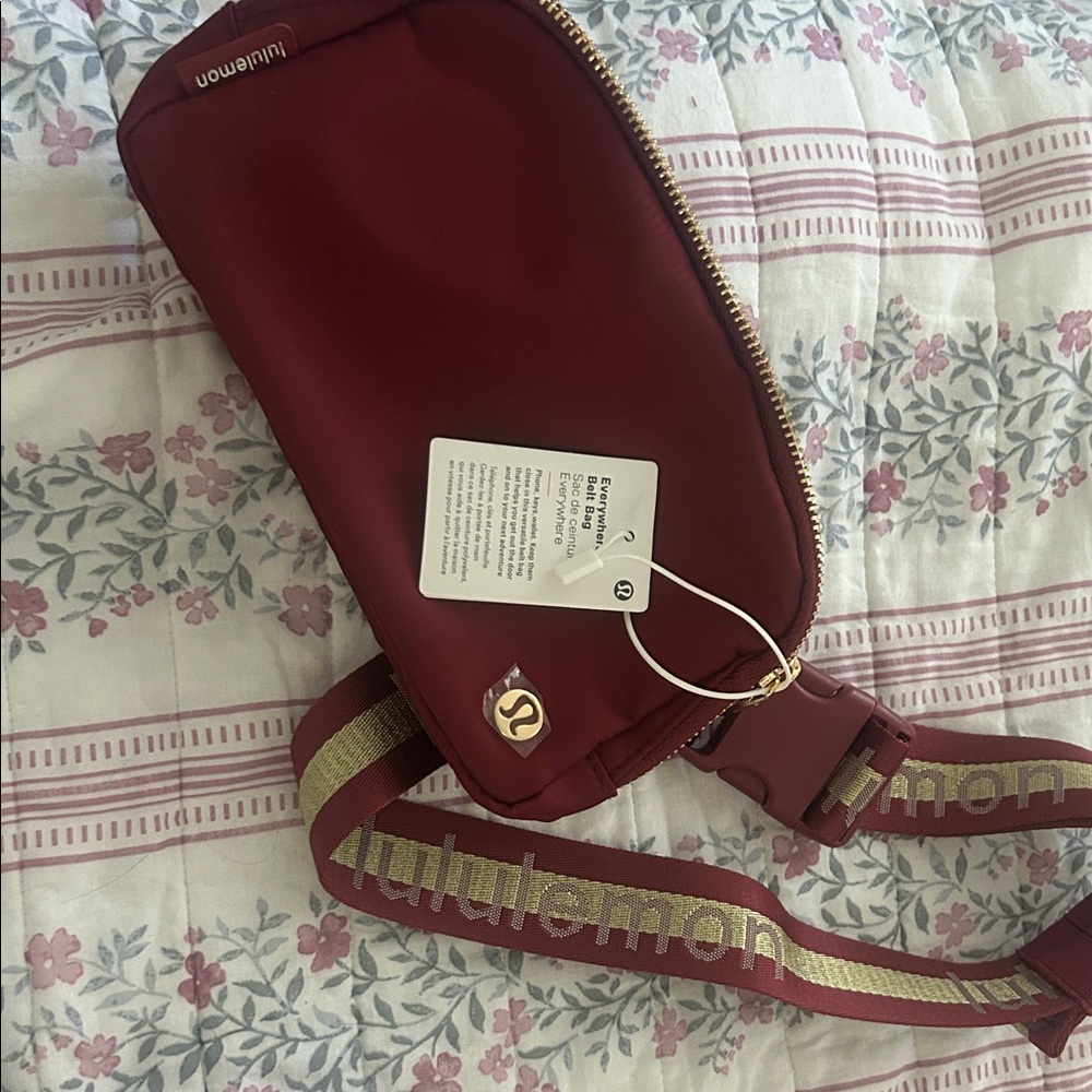 lululemon athletica Burgundy Crossbody Belt Bag with Gold Trim